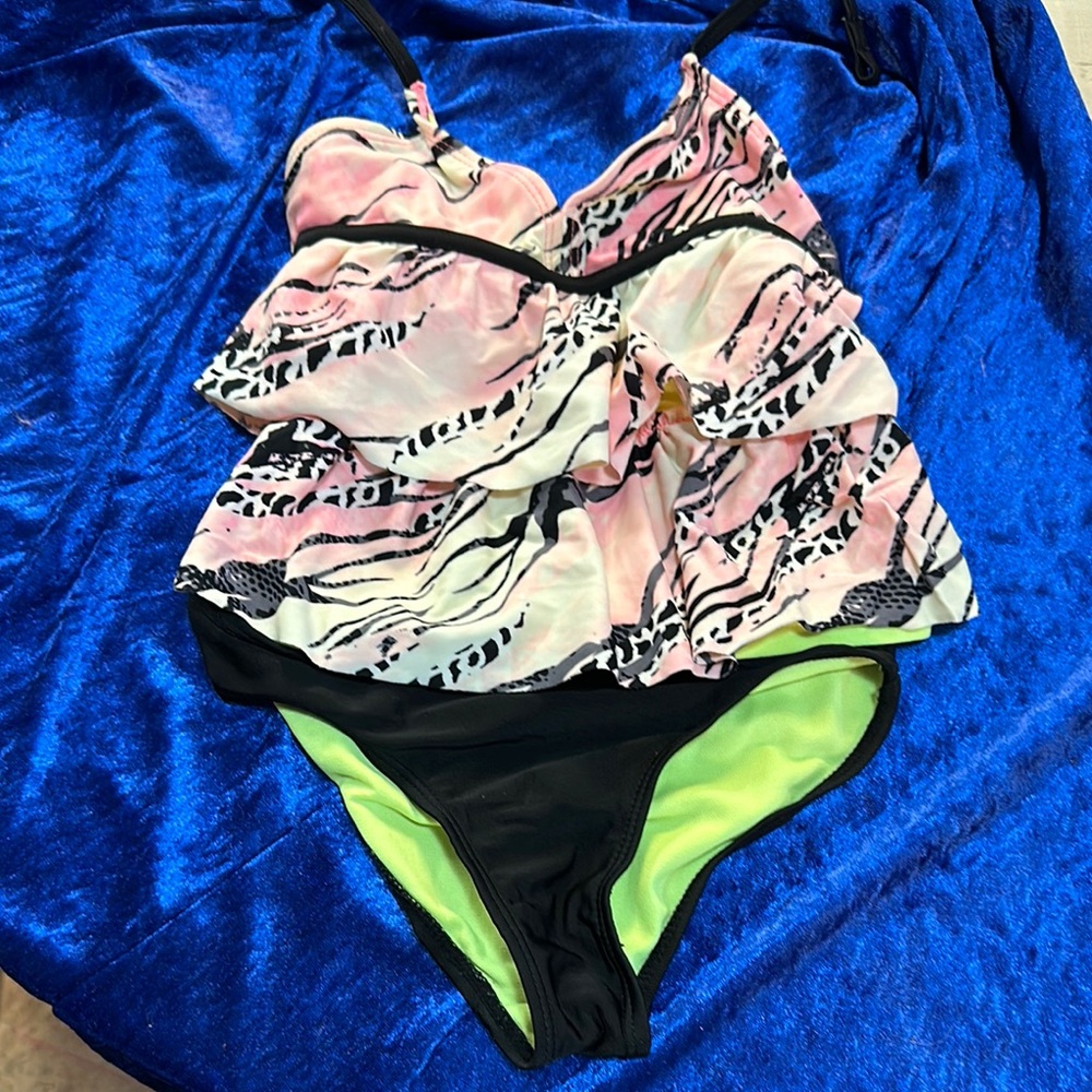 OP girls two-piece tankini. Halter ruffled front design full coverage bottom.